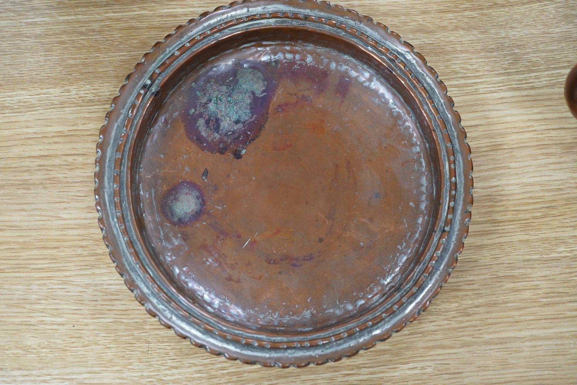 Two Middle eastern tinned copper coffee pots ‘Dallah’ a similar dish and a European copper kettle, tallest 41cm high